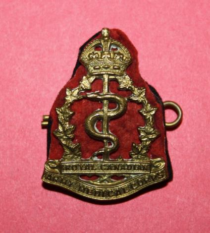 WW2 RCAMC Cap Badge with Cloth Backing